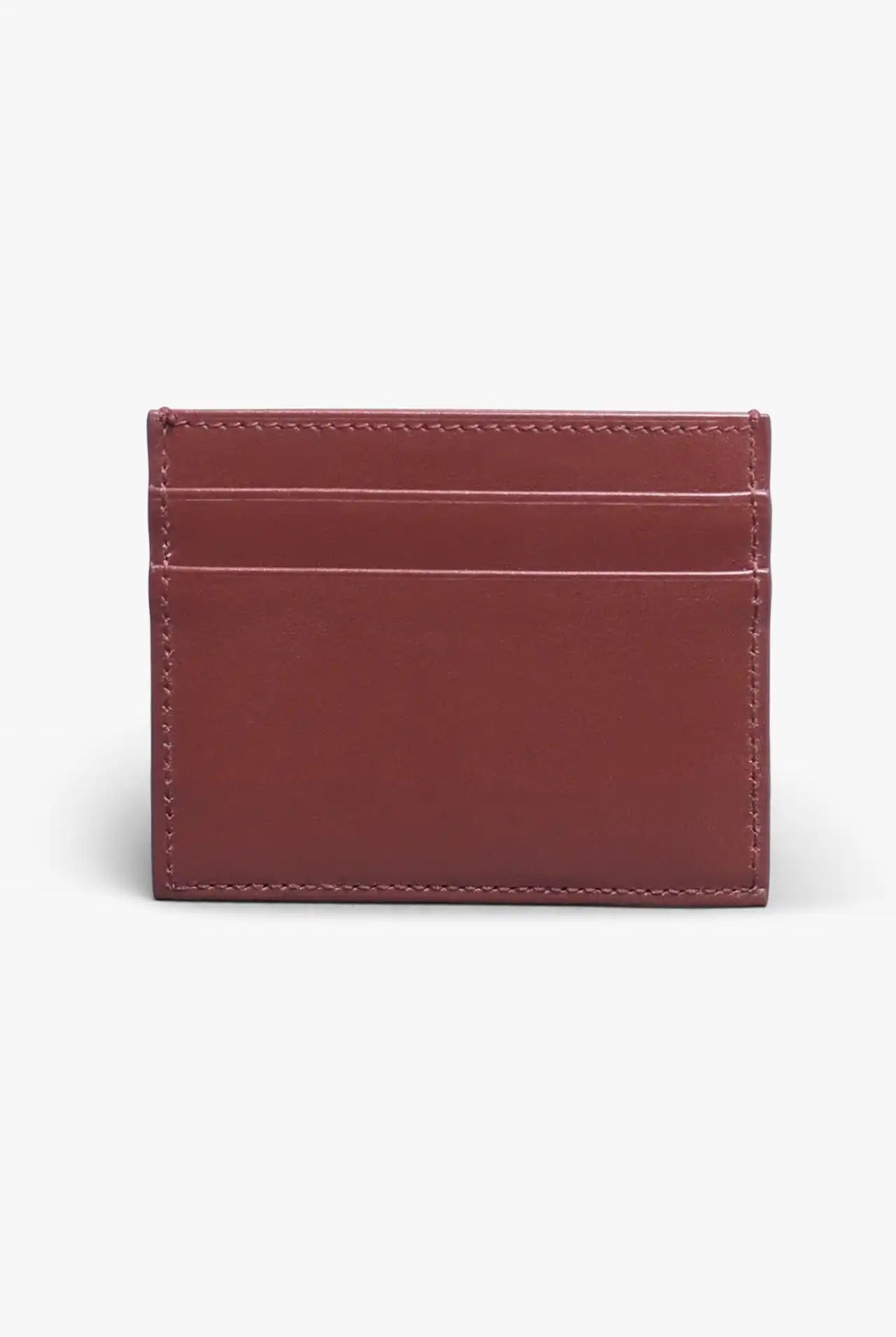 Brown card holder in vegetable tanned leather with a light gray background
