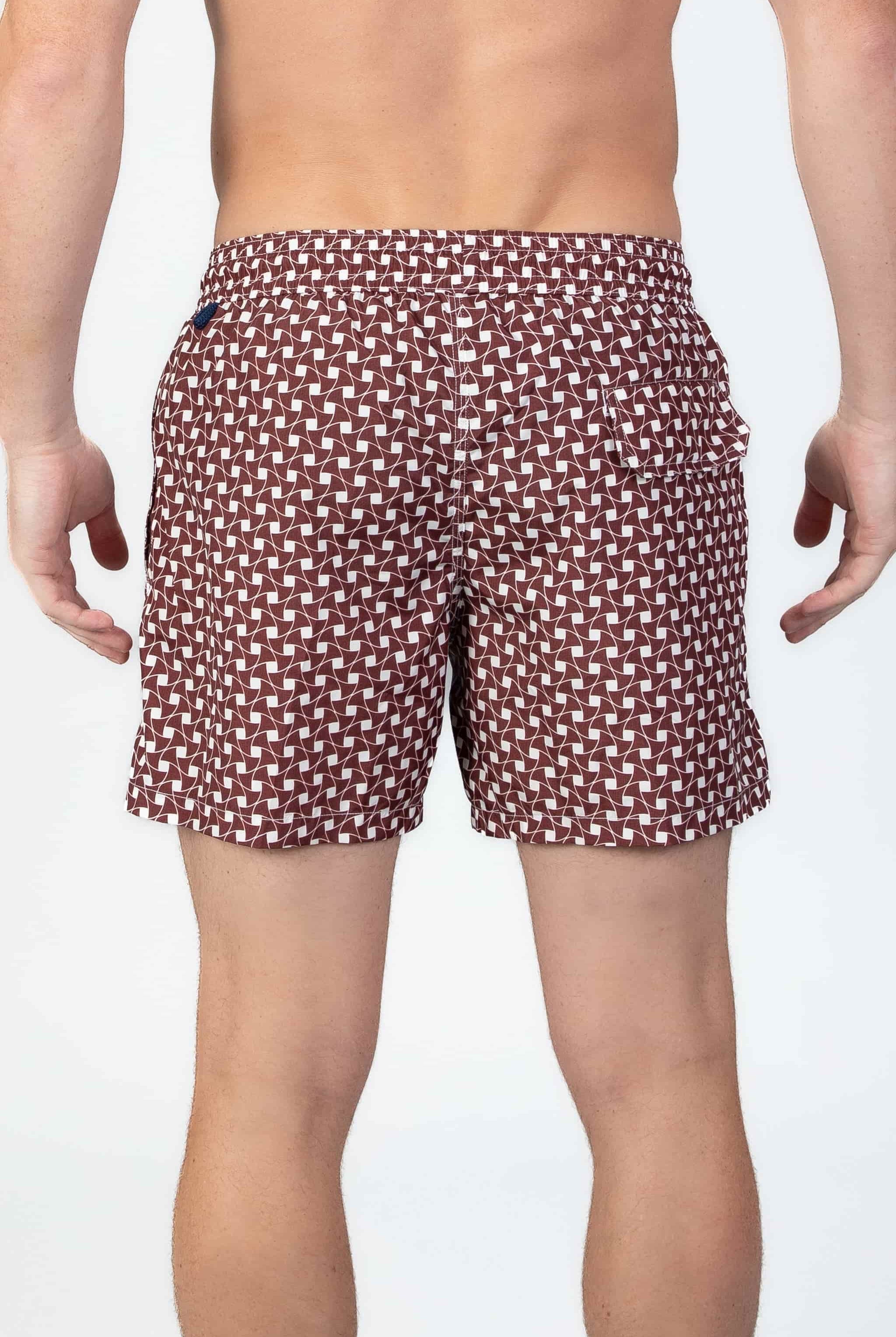 Man wearing classic Swim shorts with pattern in rusty brown and white