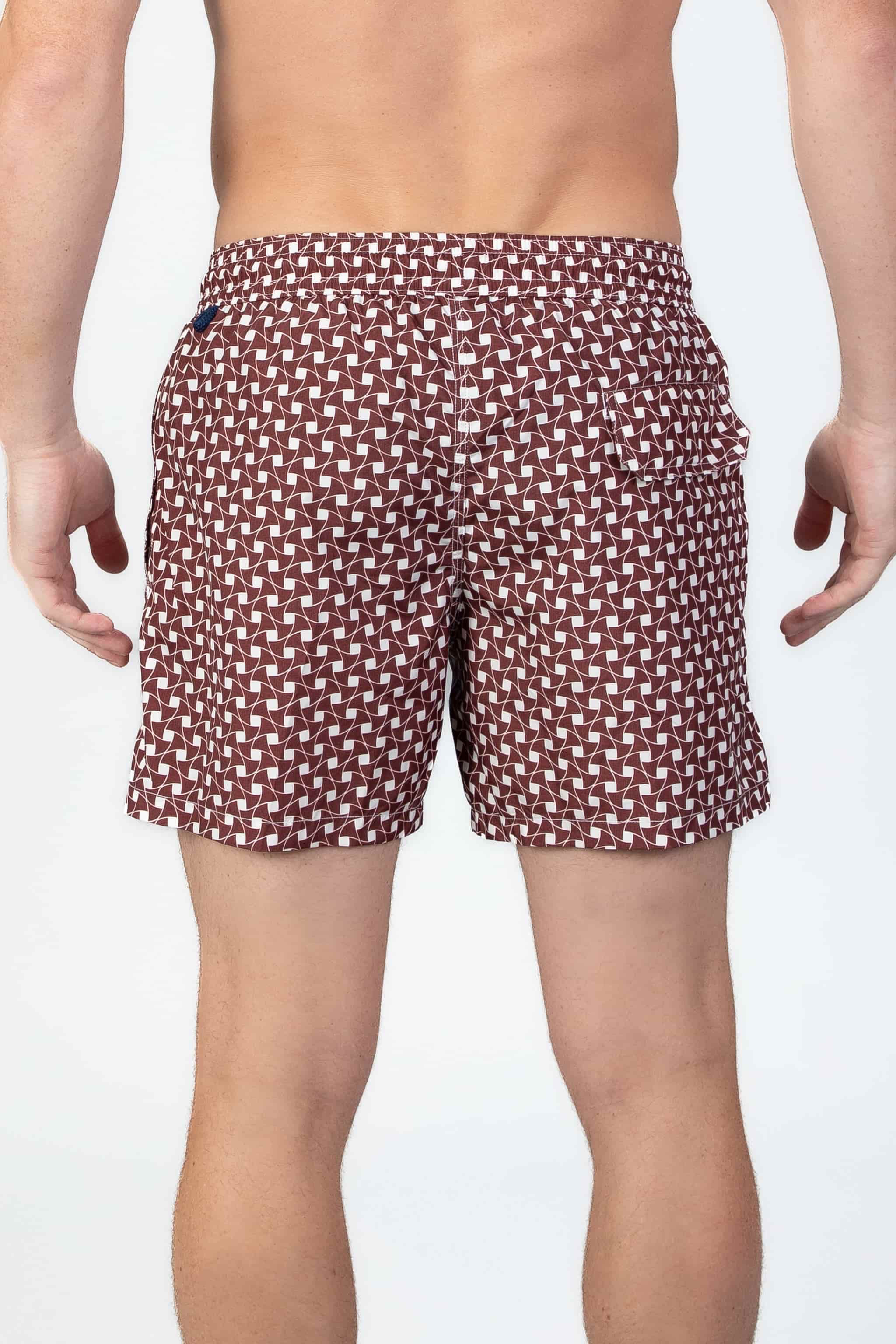 Man wearing classic Swim shorts with pattern in rusty brown and white