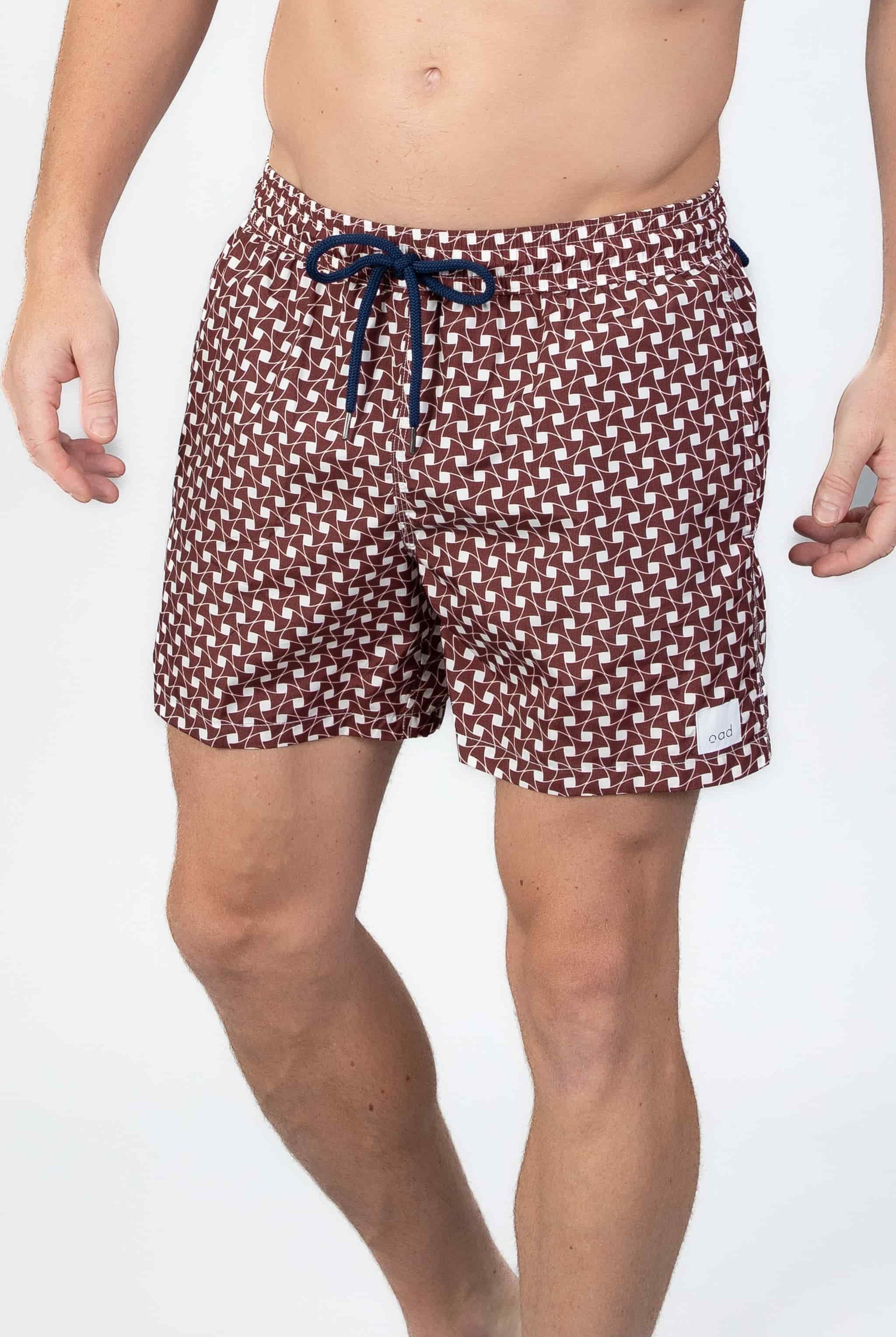 Man wearing classic Swim shorts with pattern in rusty brown and white