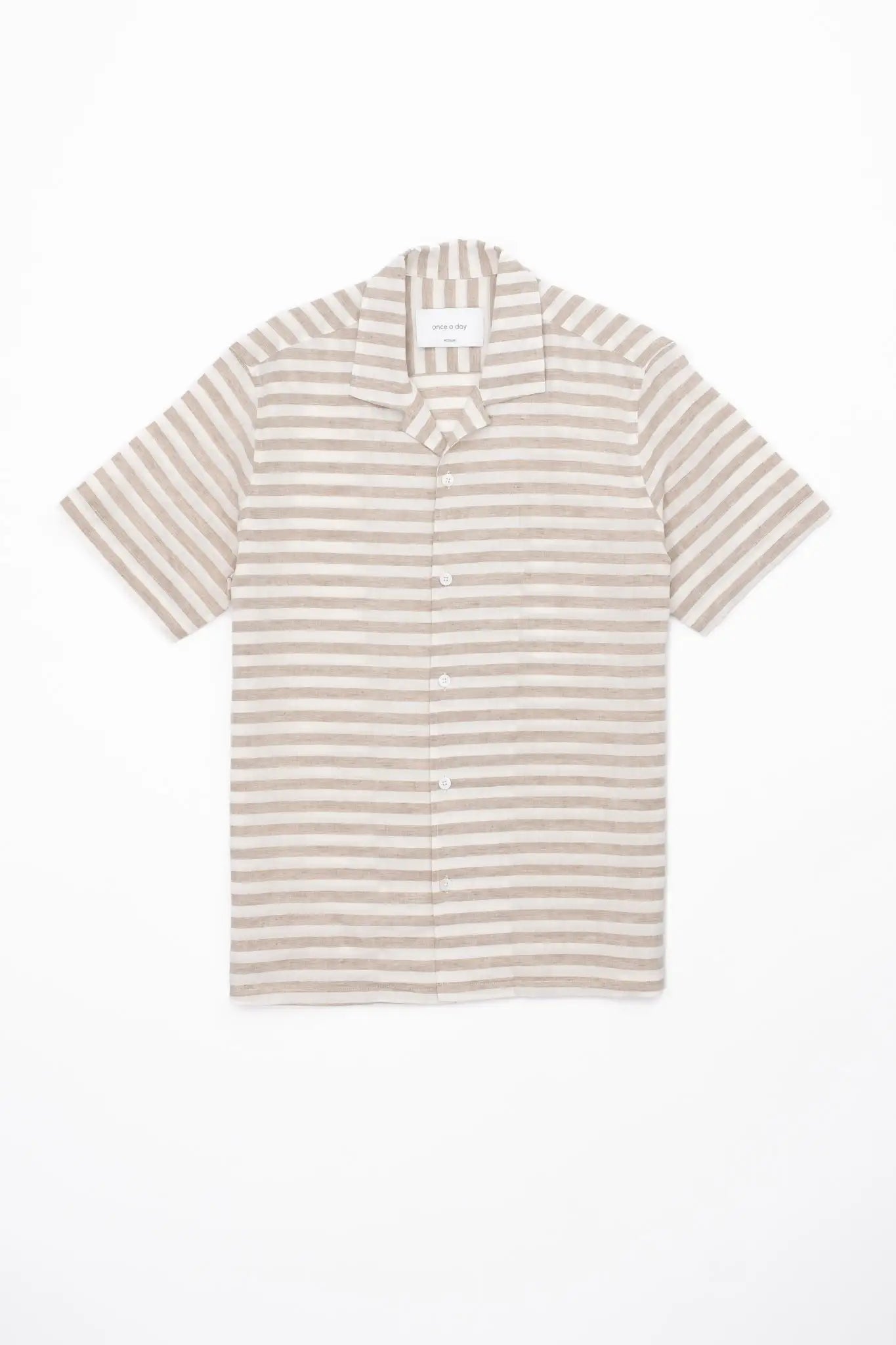 Beige and white striped linen shirt on a white background