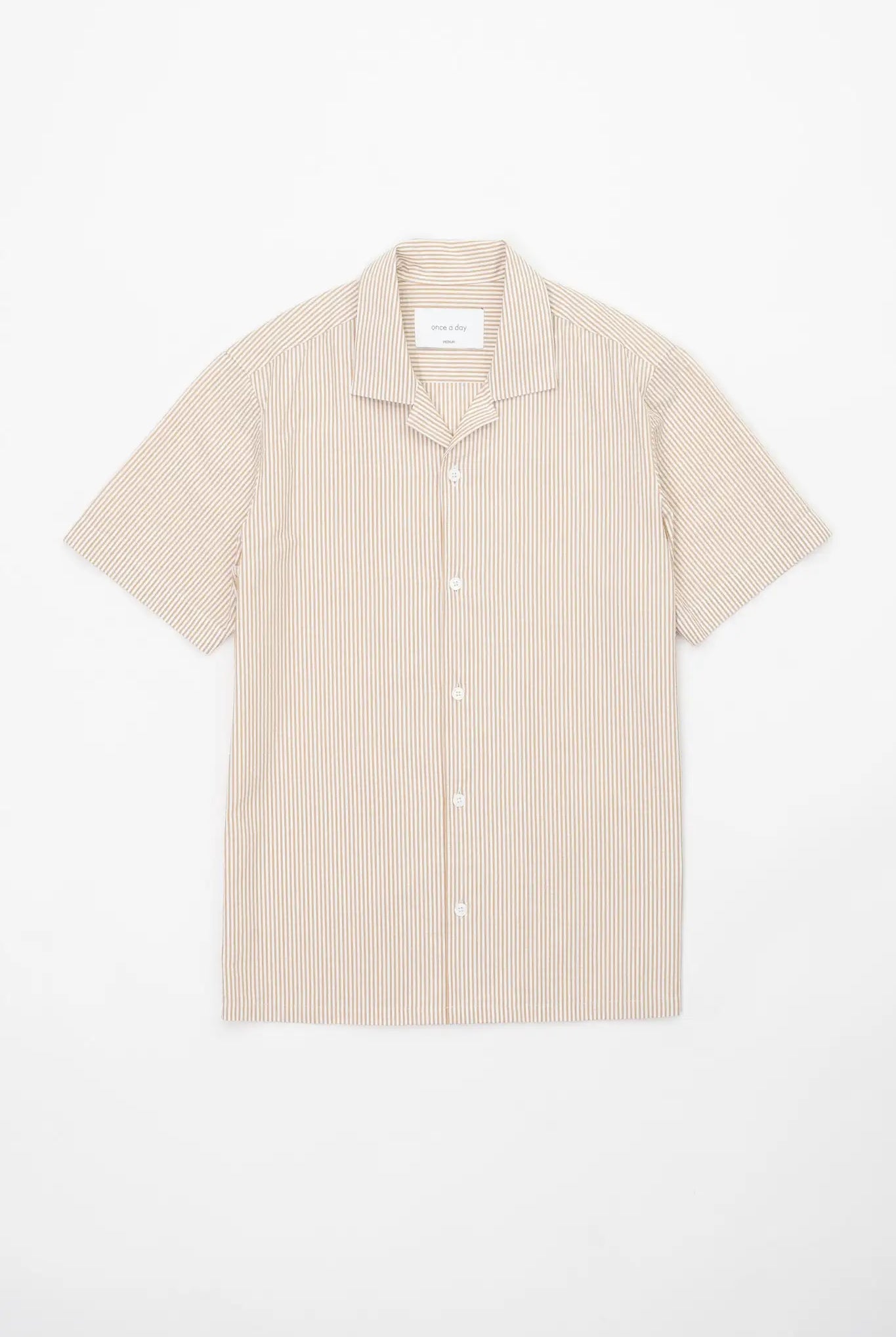 Beige striped camp collar shirt in seersucker fabric on a white background