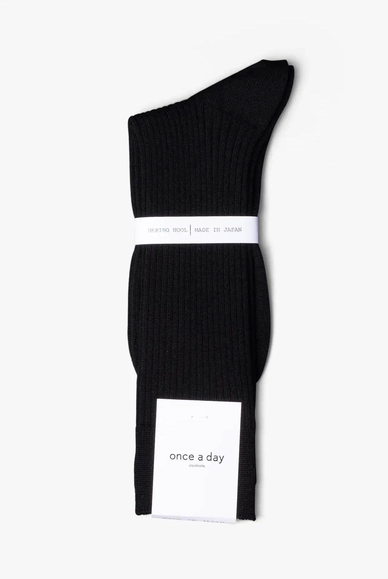 Black dress socks in merino wool. Swedish design by once a day and produced by glenn clyde. Can we washed in warm water without shrinking.
