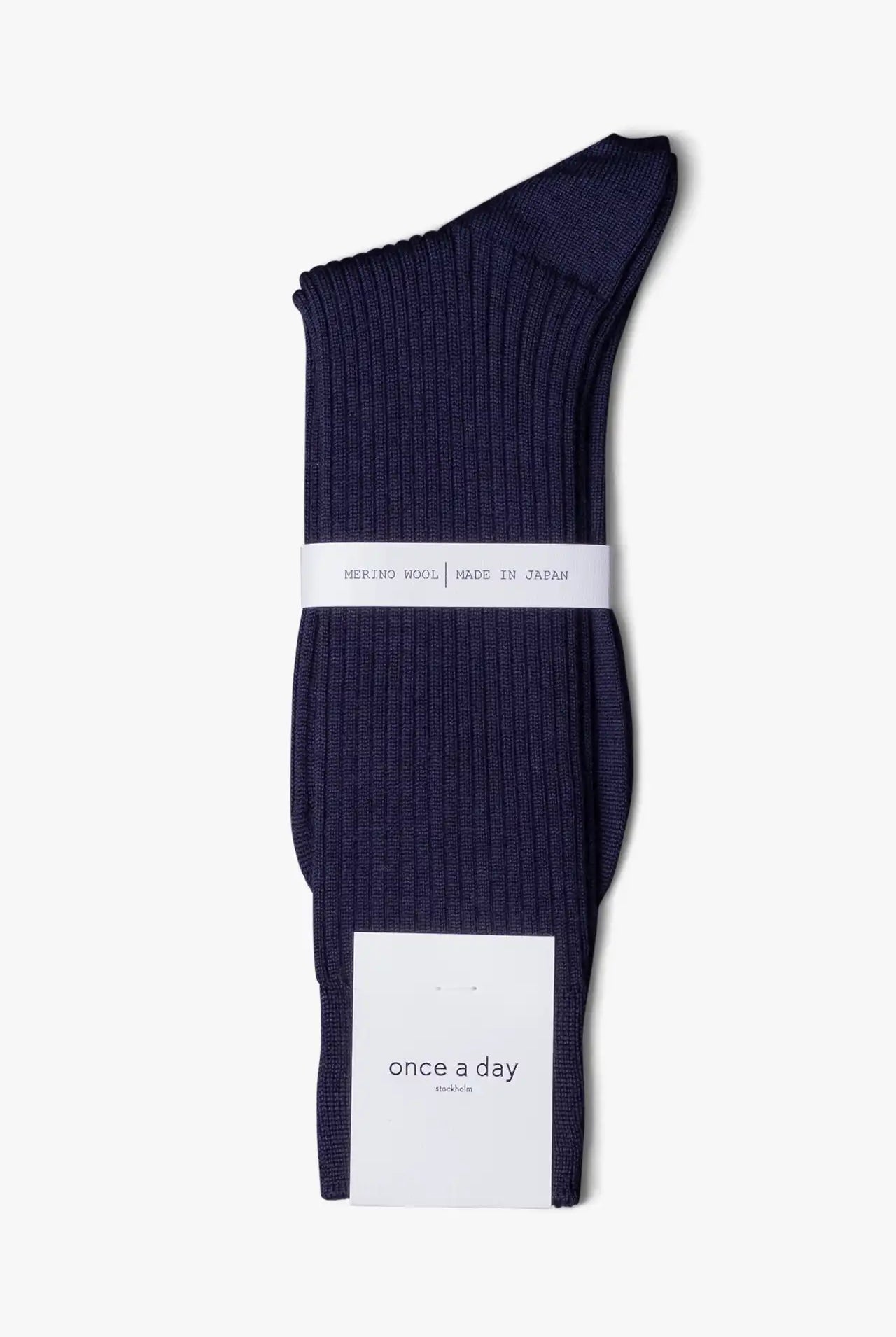 Blue dress socks in merino wool. Swedish design by once a day and produced by glenn clyde. Can we washed in warm water without shrinking.