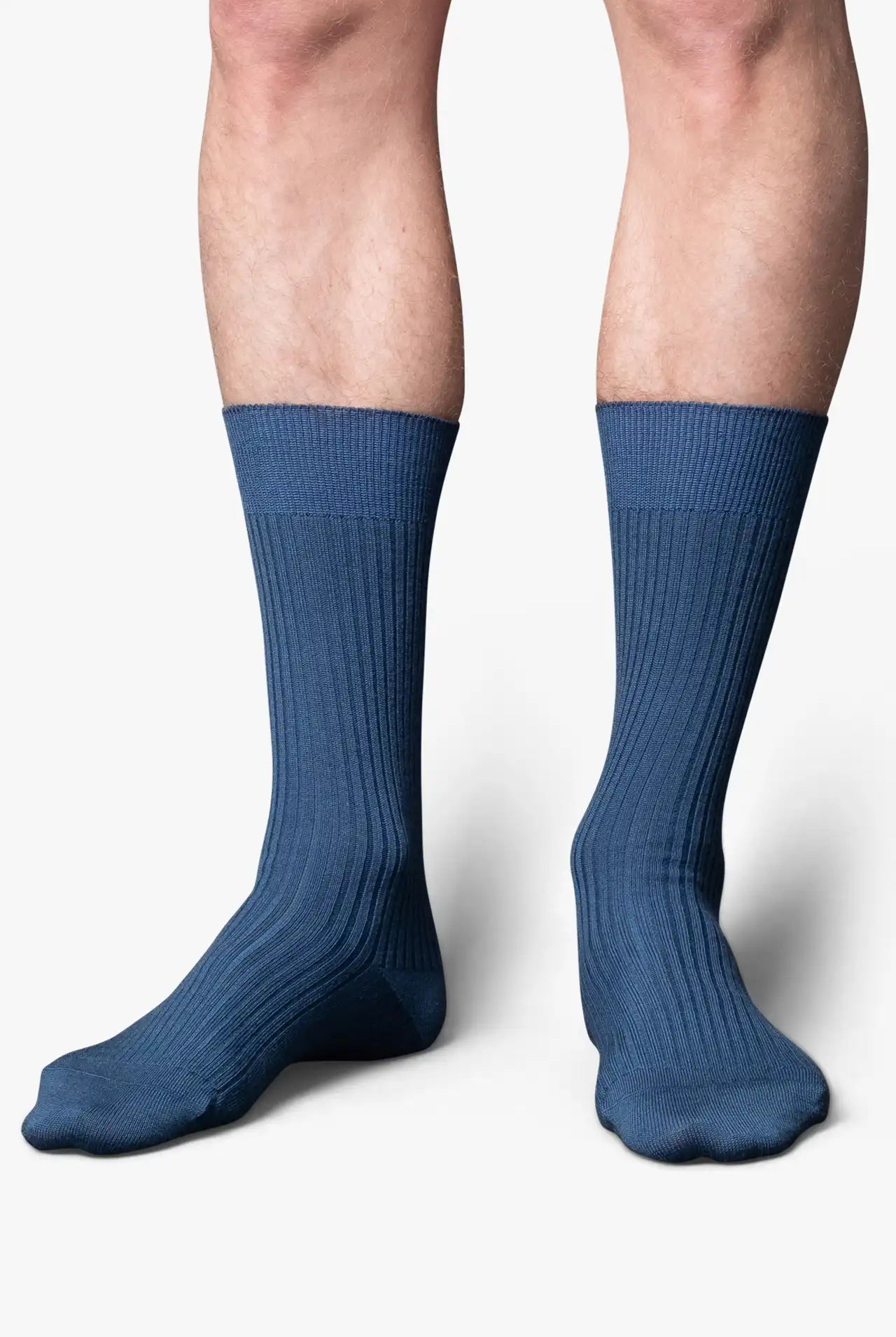 Ocean blue socks in merino wool. Swedish design by once a day and produced by glenn clyde. Can we washed in warm water without shrinking.