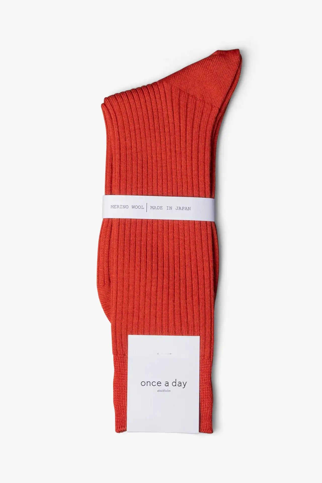 Orange copper socks in merino wool. Swedish design by once a day and produced by glenn clyde. Can we washed in warm water without shrinking.