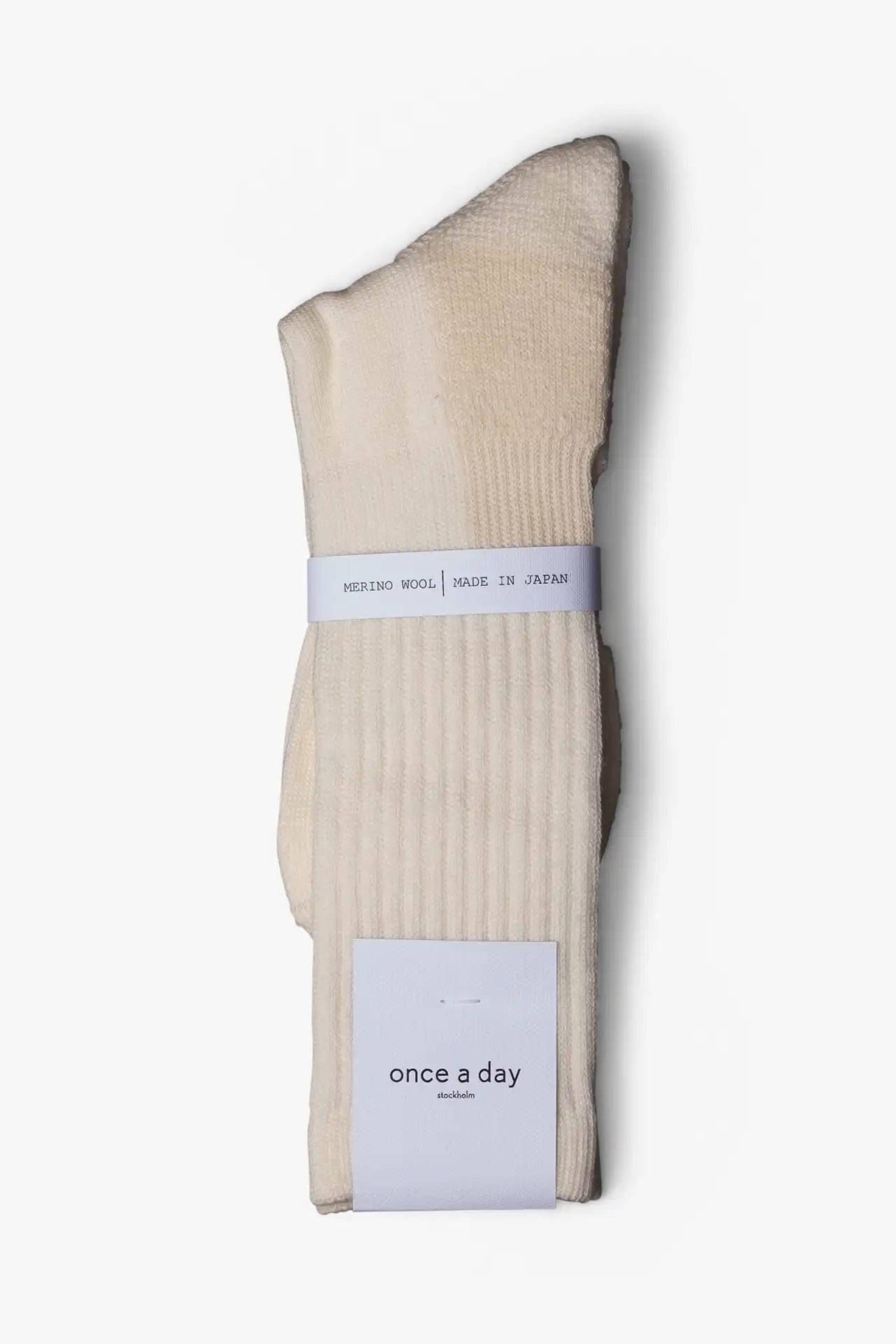 Cream white casual boot sock in merino wool. Swedish design by once a day and produced by glenn clyde. Can we washed in warm water without shrinking.