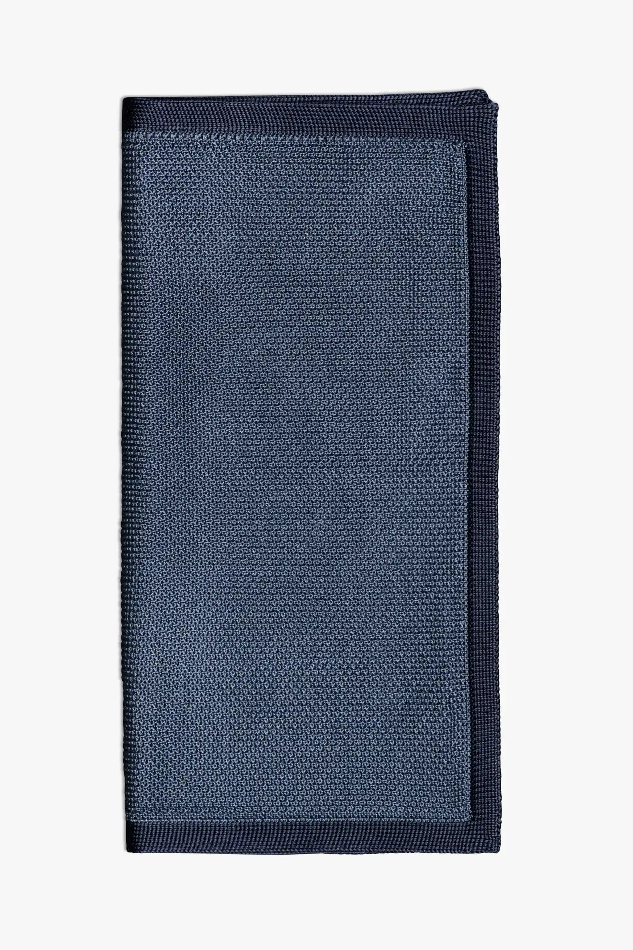 Blue knitted pocket square with navy blue boarder. Made of silk in Italy paired with Matching tie.