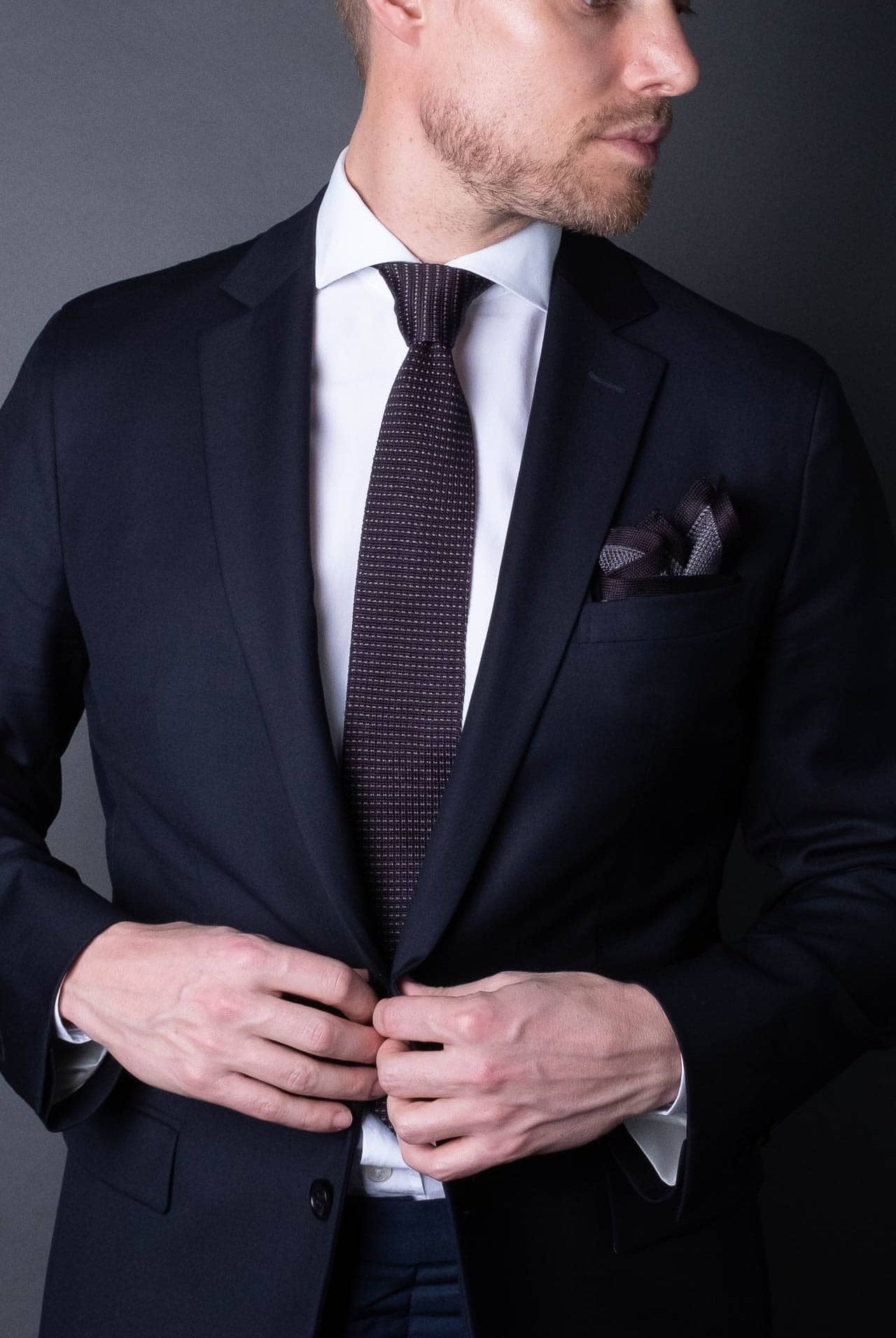 Gray knitted pocket square with gray boarder. Made of silk in Italy paired with Matching tie.