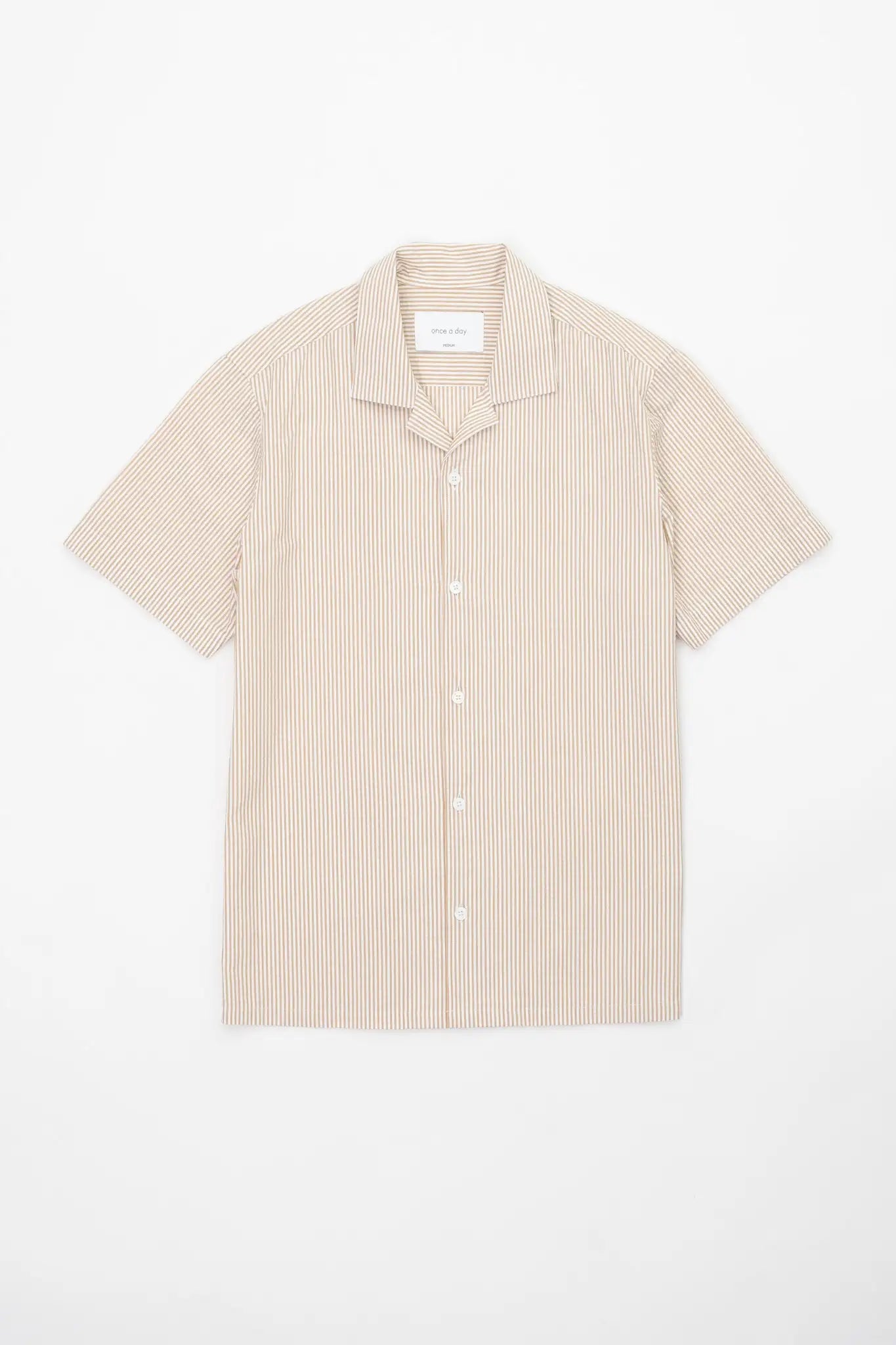 Beige striped camp collar shirt  in seersucker fabric on a white background