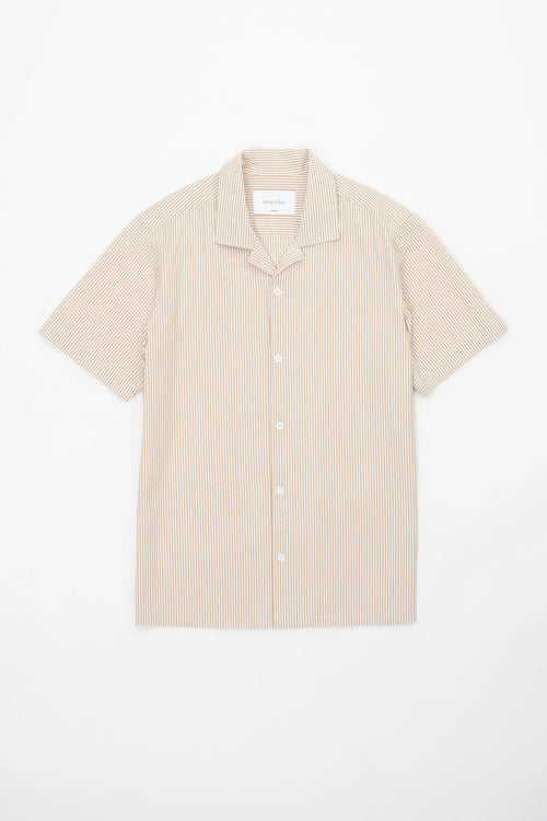 Beige striped camp collar shirt  in seersucker fabric on a white background