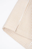 Close-up of a side slit on a striped shirt