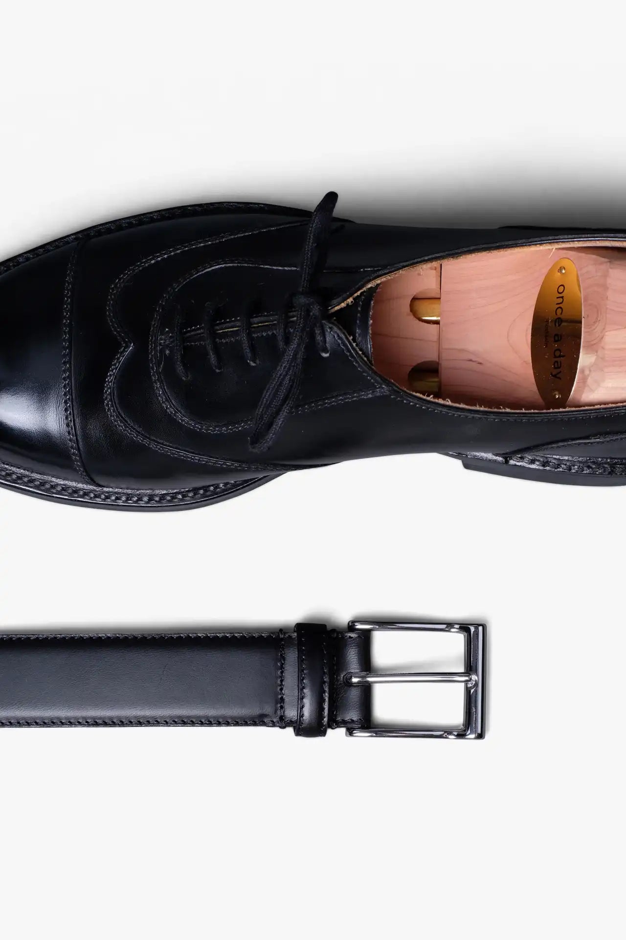 Black Leather Belt in minimalist design, Made in Italy from vegetable tanned leather. Perfect to match with hand made dress shoes. 