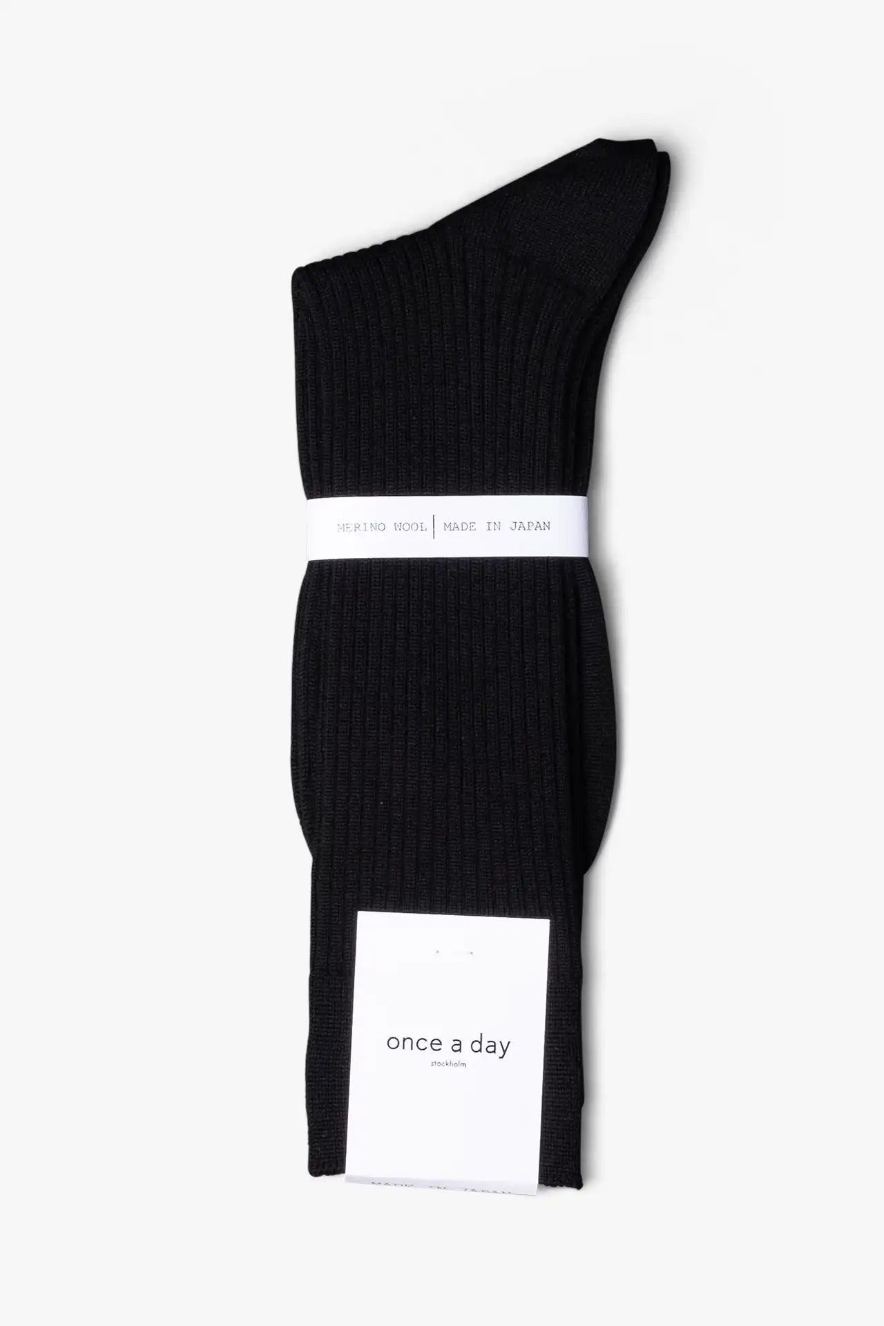 Black dress socks in merino wool. Swedish design by once a day and produced by glenn clyde. Can we washed in warm water without shrinking.