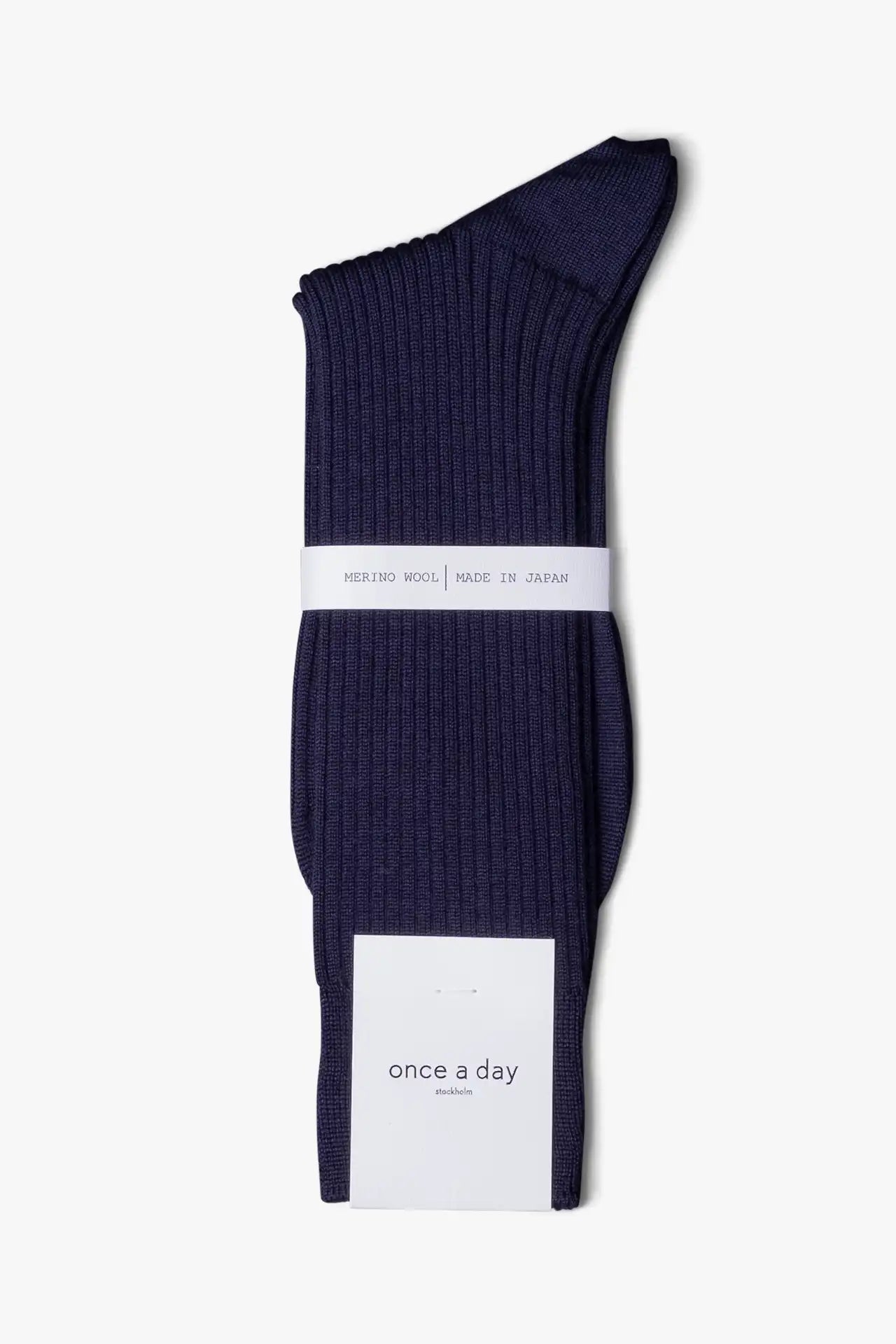 Blue dress socks in merino wool. Swedish design by once a day and produced by glenn clyde. Can we washed in warm water without shrinking.