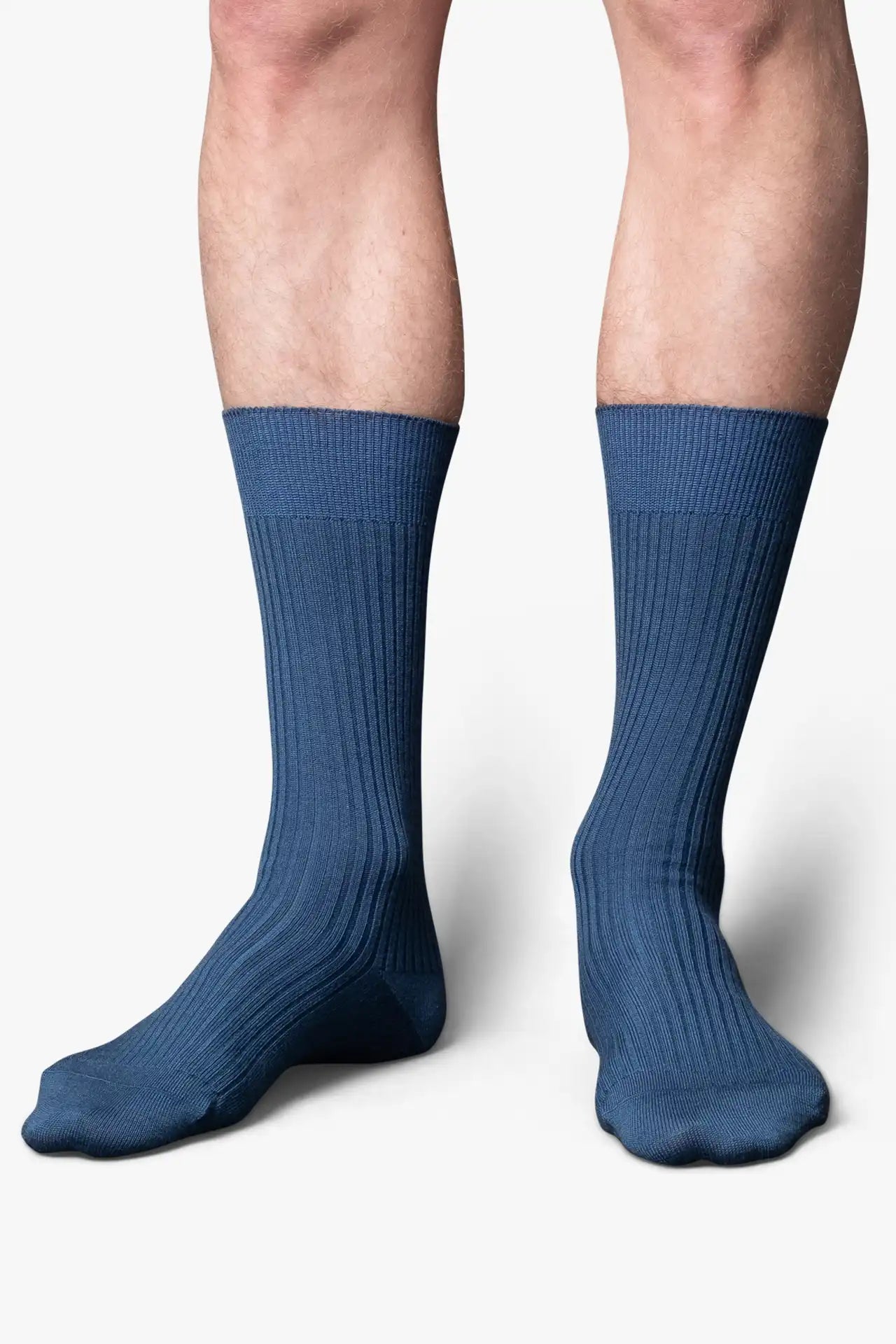 Ocean blue socks in merino wool. Swedish design by once a day and produced by glenn clyde. Can we washed in warm water without shrinking.