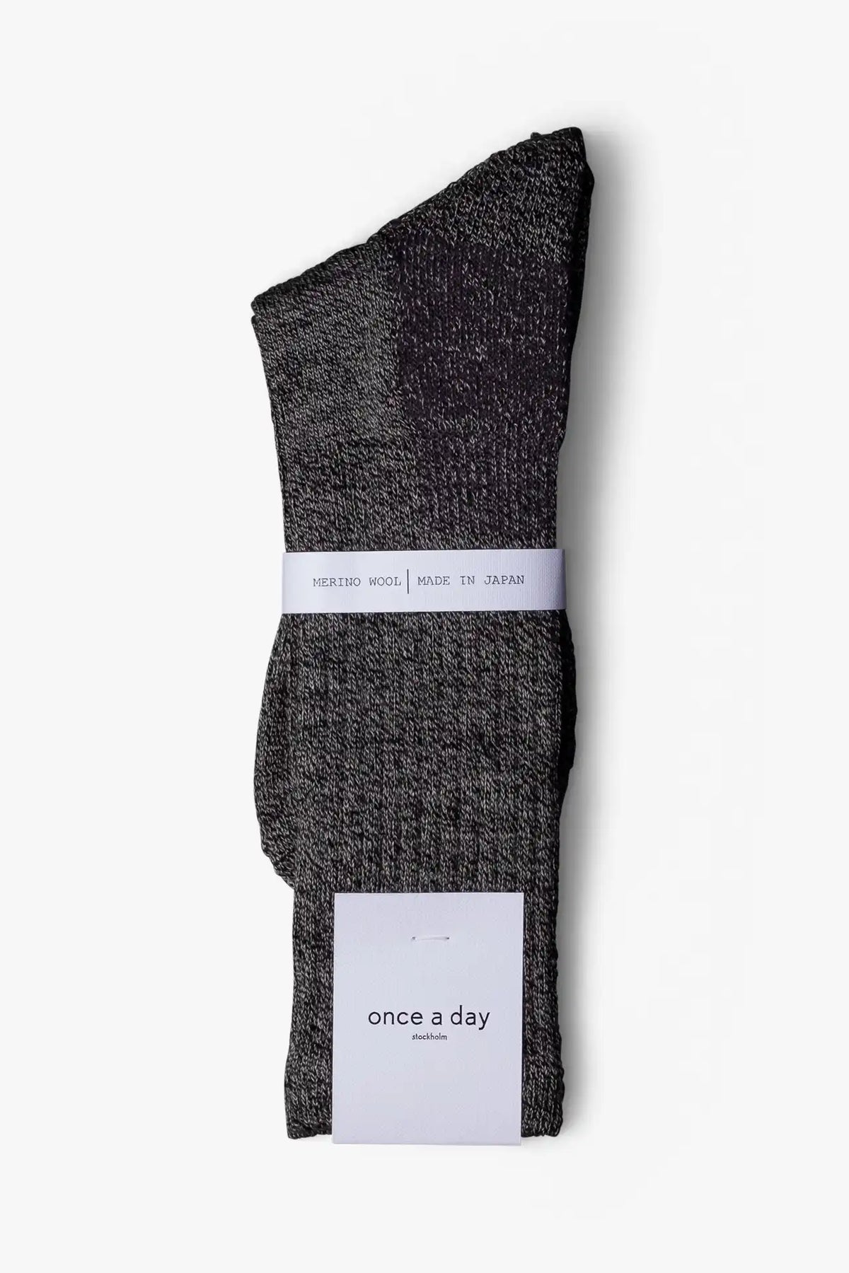 Dark gray casual boot sock in merino wool. Swedish design by once a day and produced by glenn clyde. Can we washed in warm water without shrinking.