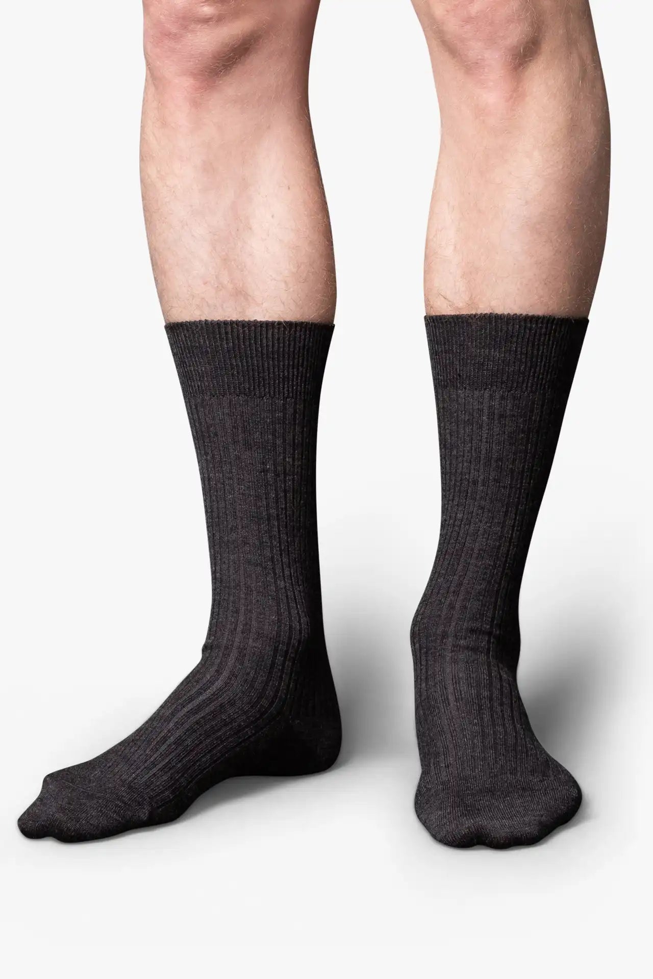 Dark gray melange dress socks in merino wool. Swedish design by once a day and produced by glenn clyde. Can we washed in warm water without shrinking.
