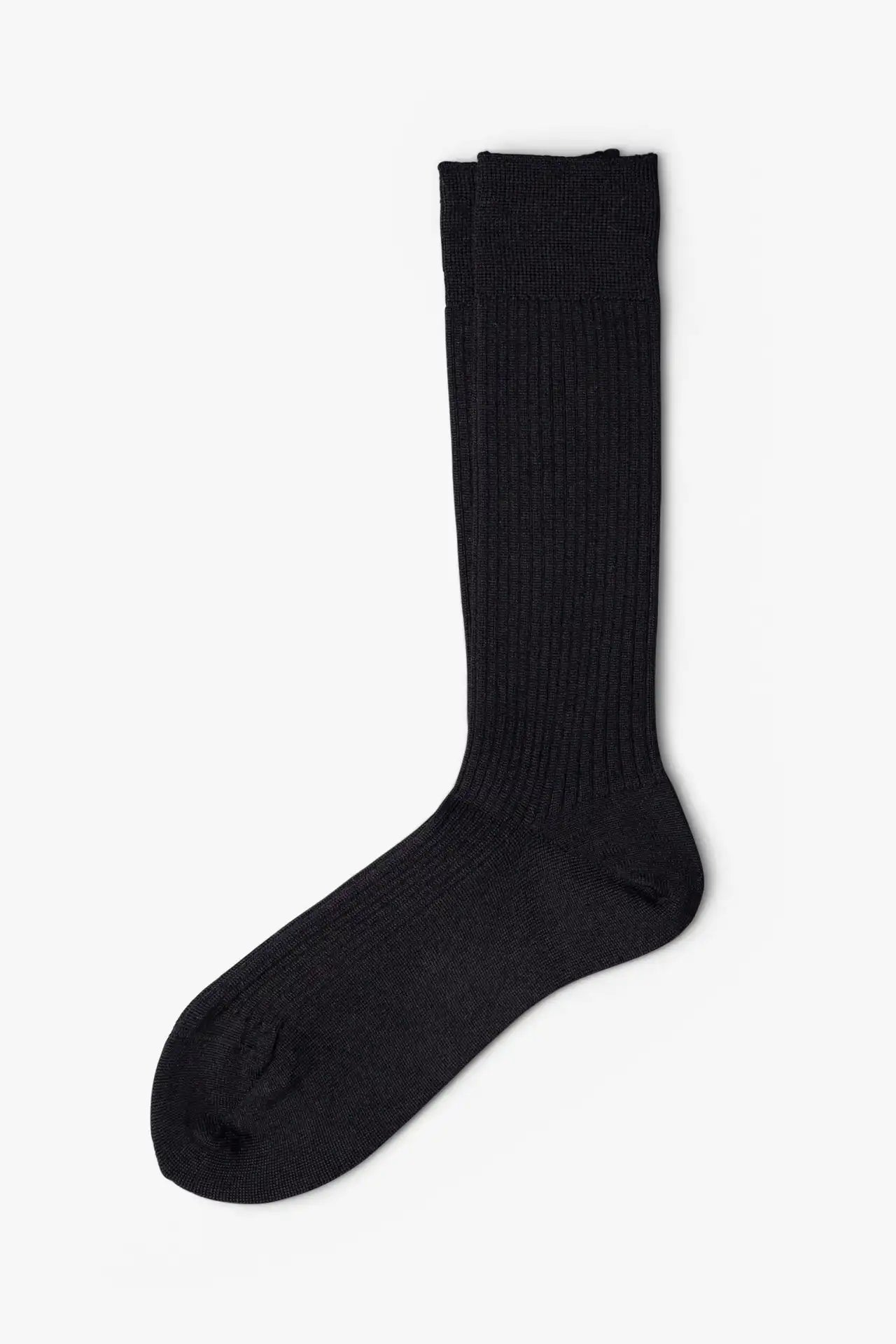 Black dress socks in merino wool. Swedish design by once a day and produced by glenn clyde. Can we washed in warm water without shrinking.