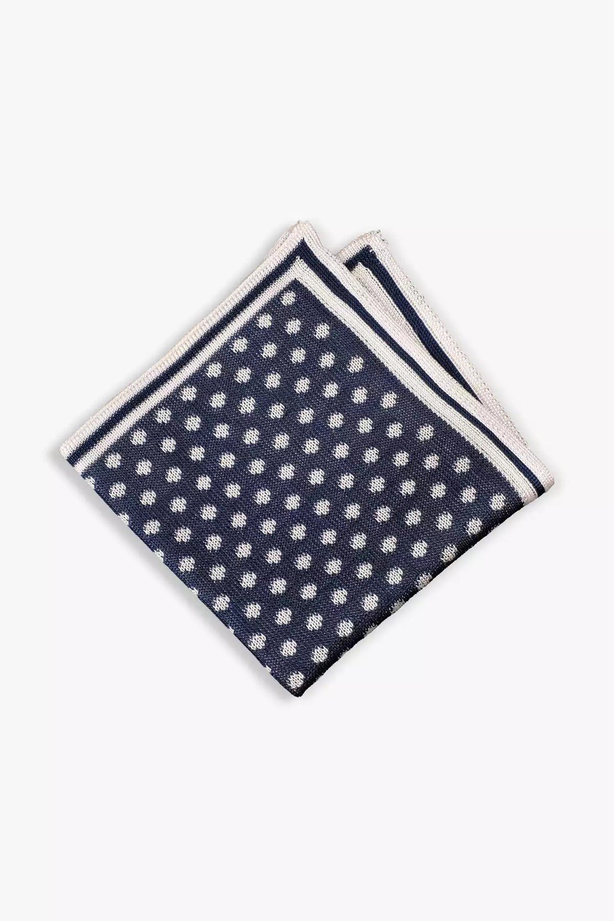Navy blue knitted pocket square with white dots in knitted silk