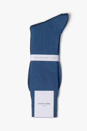 Ocean blue socks in merino wool. Swedish design by once a day and produced by glenn clyde. Can we washed in warm water without shrinking.