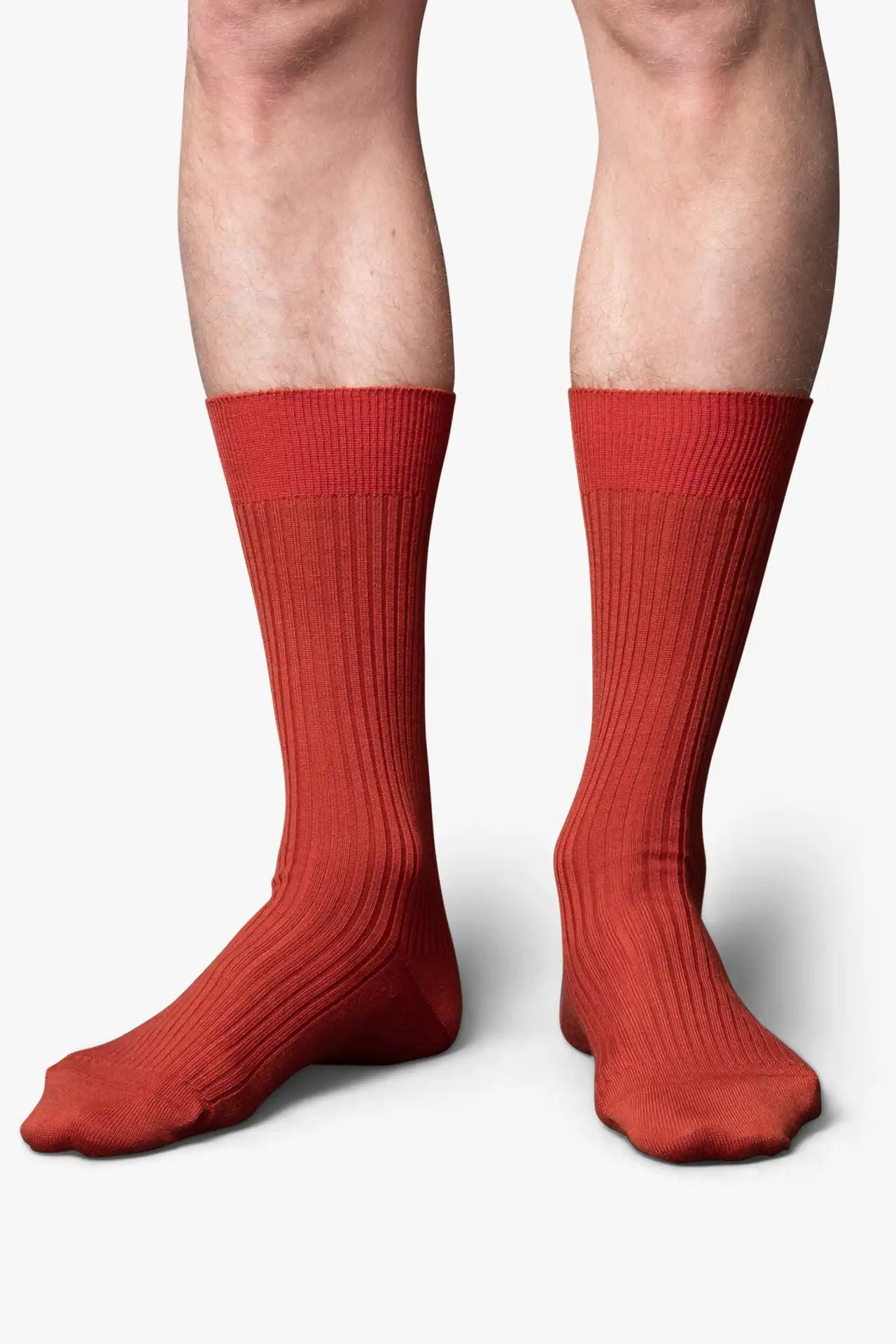 Orange copper socks in merino wool. Swedish design by once a day and produced by glenn clyde. Can we washed in warm water without shrinking.