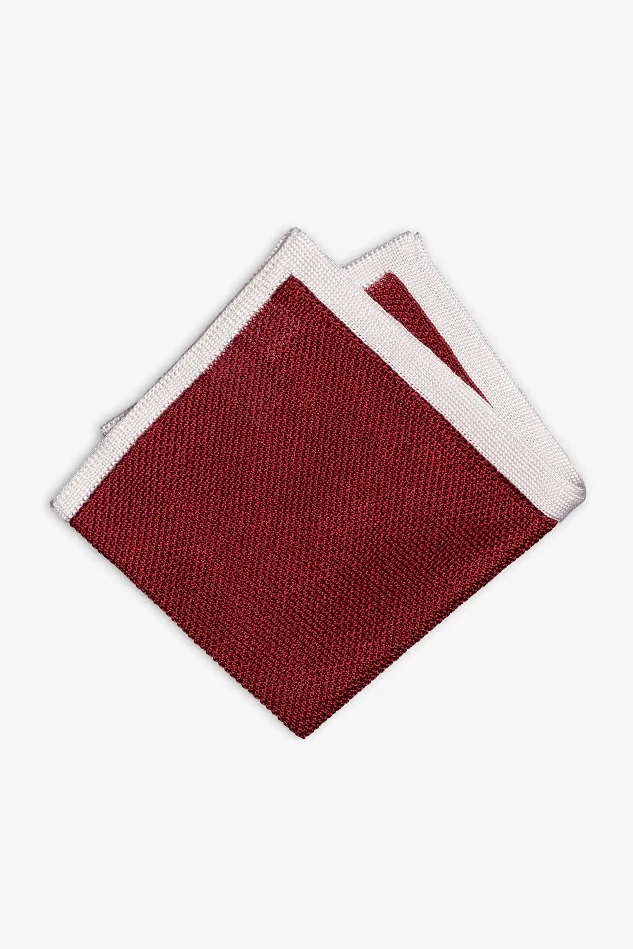 Red knitted pocket square with white frame. Made of silk in Italy.