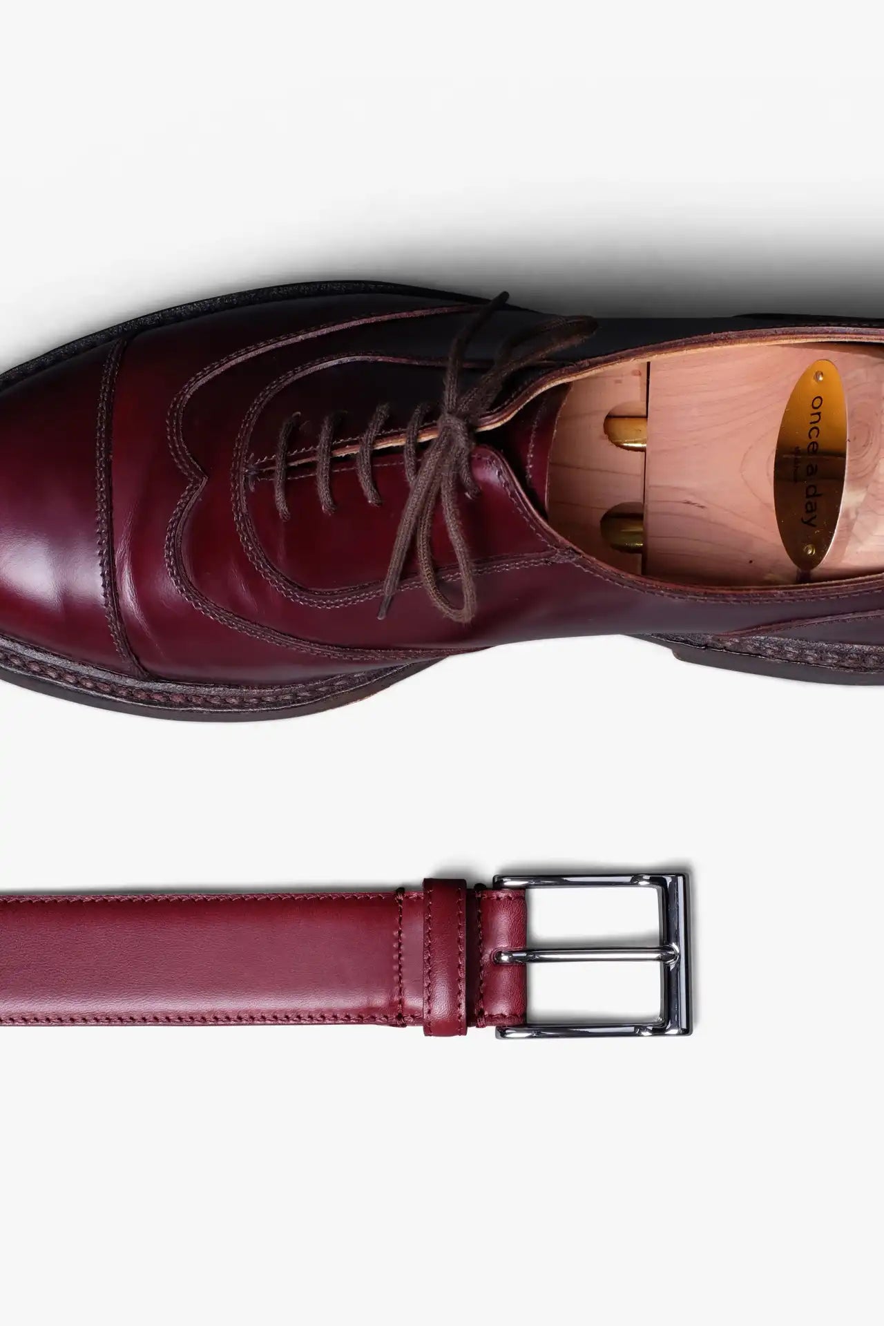 Rosewood Red Leather Belt in minimalist design, Made in Italy from vegetable tanned leather. Perfect to match with hand made dress shoes. 