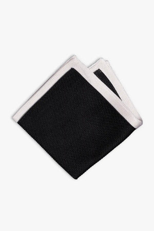 Black knitted pocket square with white frame. Made of silk in Italy.