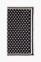 Black knitted pocket square with white dots in knitted silk