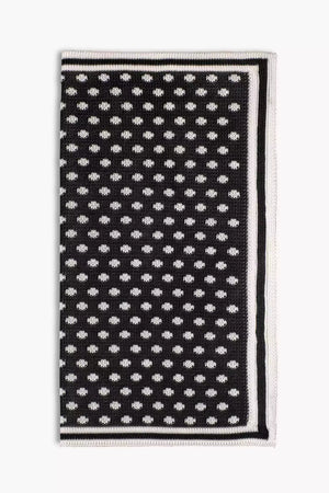 Black knitted pocket square with white dots in knitted silk