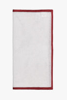 White knitted silk pocket square with red frame. Made in Italy.