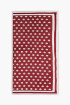 Red knitted pocket square with white dots in knitted silk with matching bow tie