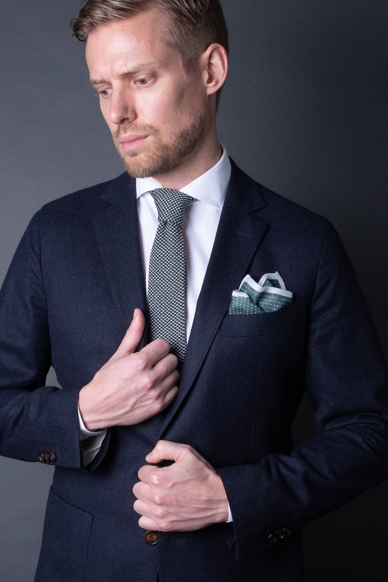 Green and white knitted pocket square with white boarder in cotton with matching tie