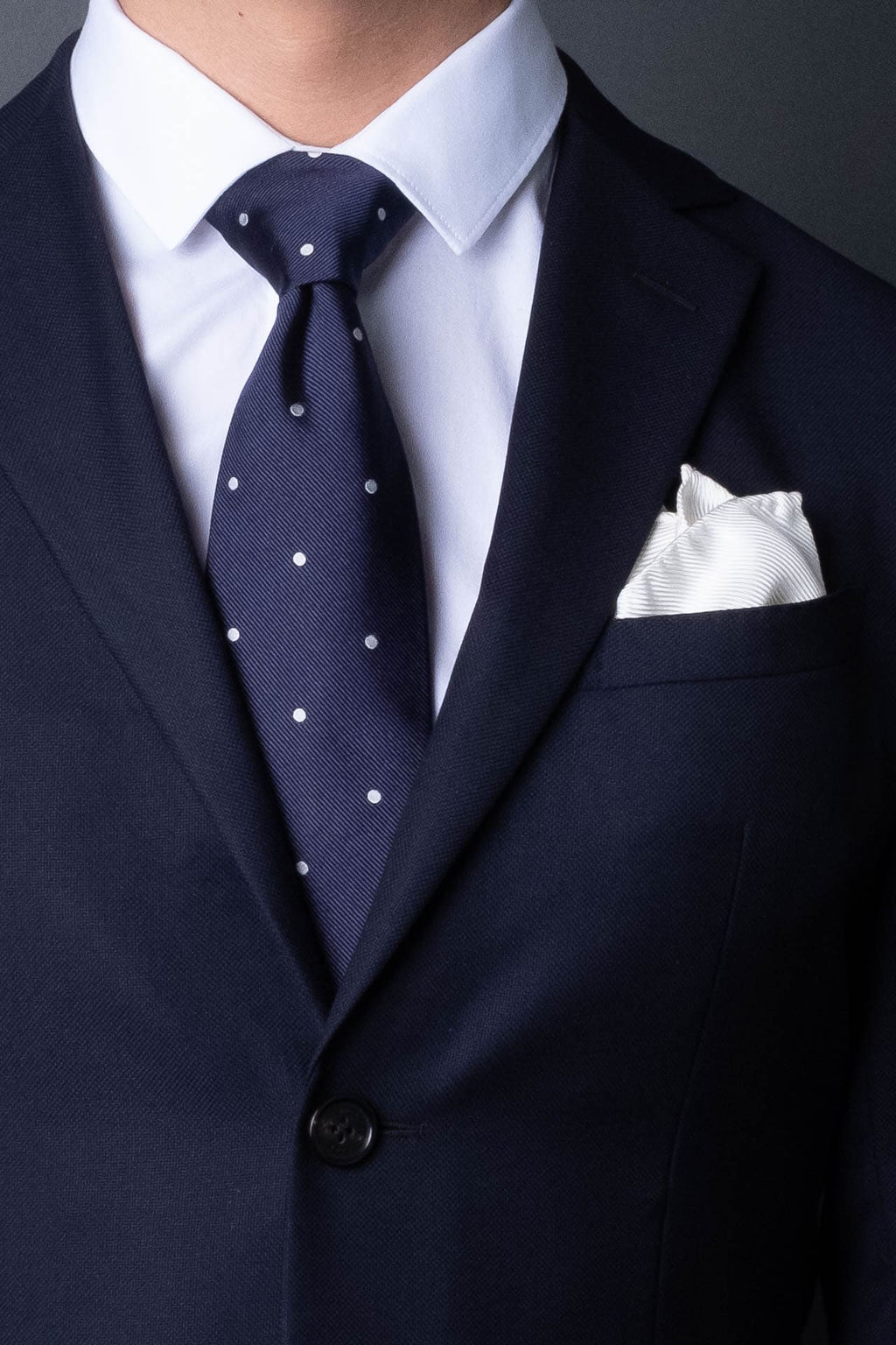 white silk pocket square in twill. Perfect for festive and formal occasions. Made in Italy.