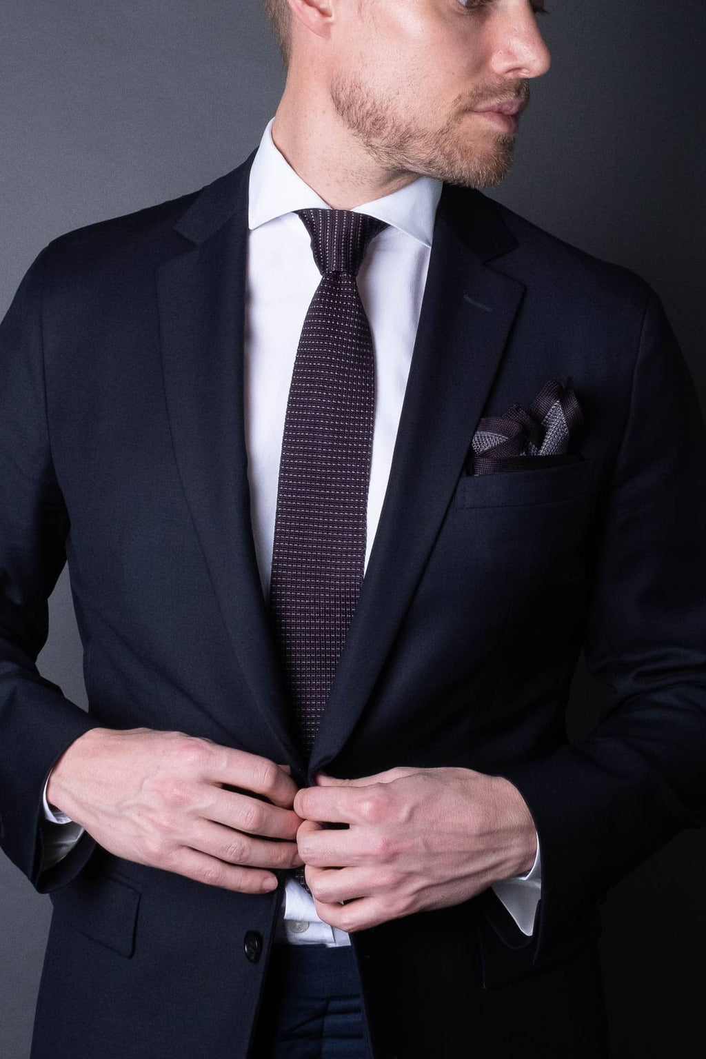 Gray knitted pocket square with gray boarder. Made of silk in Italy paired with Matching tie.