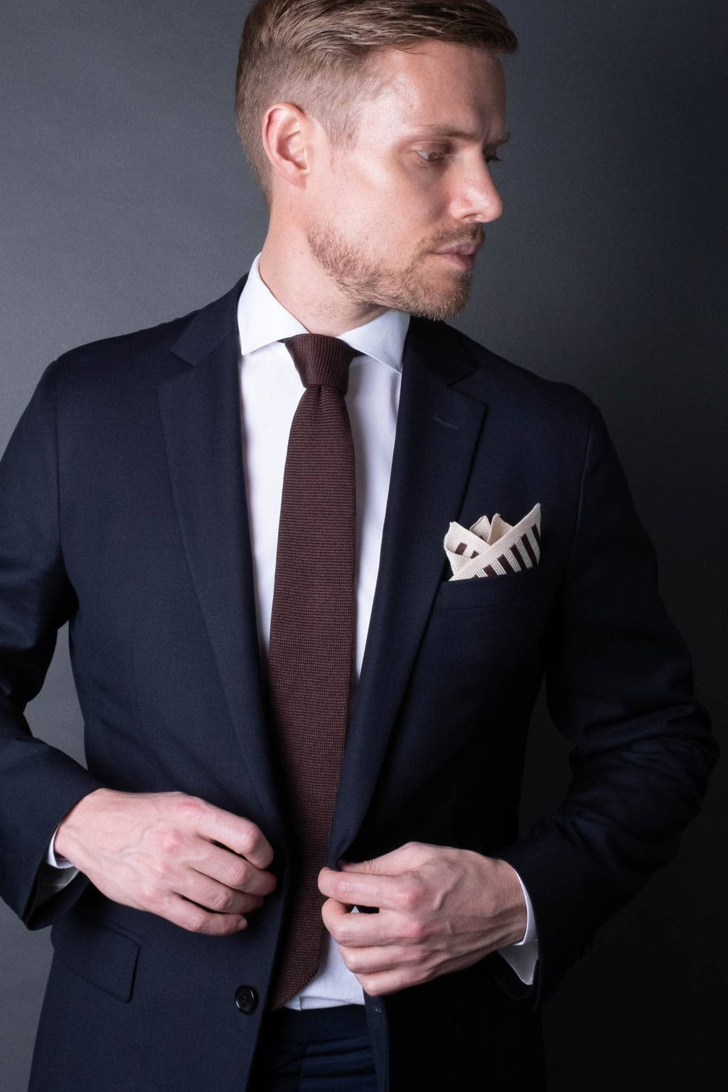 Brown and white striped knitted silk pocket square. Made in Italy paired with Matching tie.