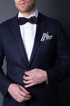Black knitted pocket square with white dots in knitted silk with matching bow tie