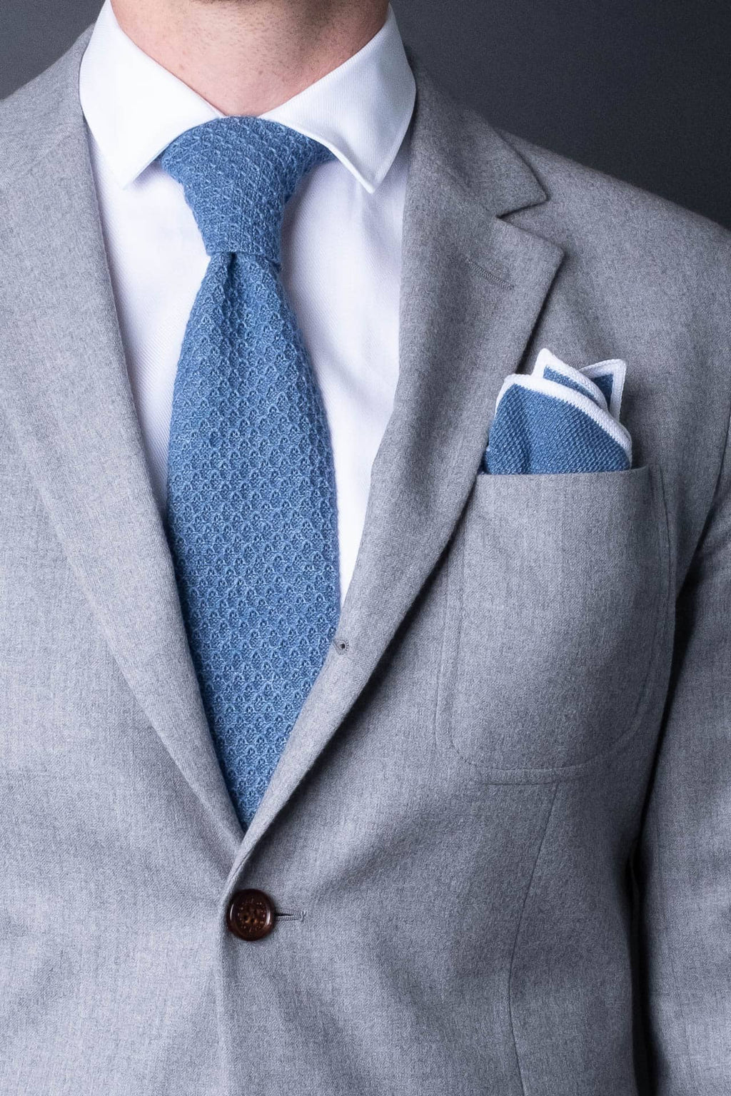 Blue knitted pocket square with white boarder in knitted cotton with matching tie