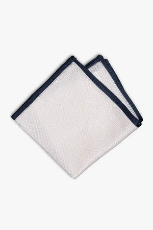 White knitted silk pocket square with navy blue frame. Made in Italy paired with Matching tie.