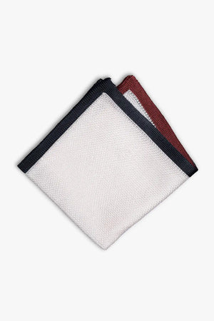 White pocket square with navy blue and red boarder. Knitted silk made in Italy with matching tie.